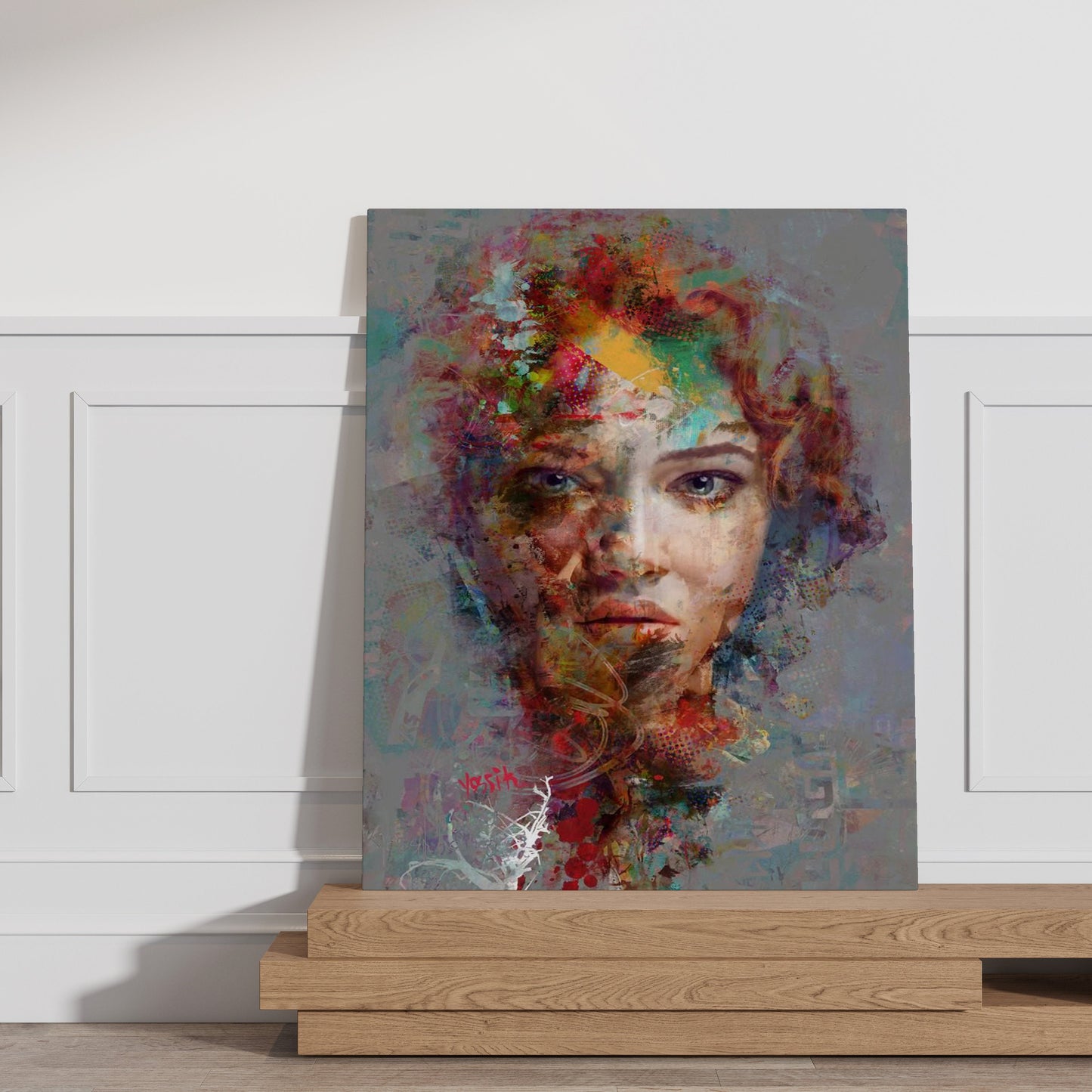 a painting of a woman's face on a wall