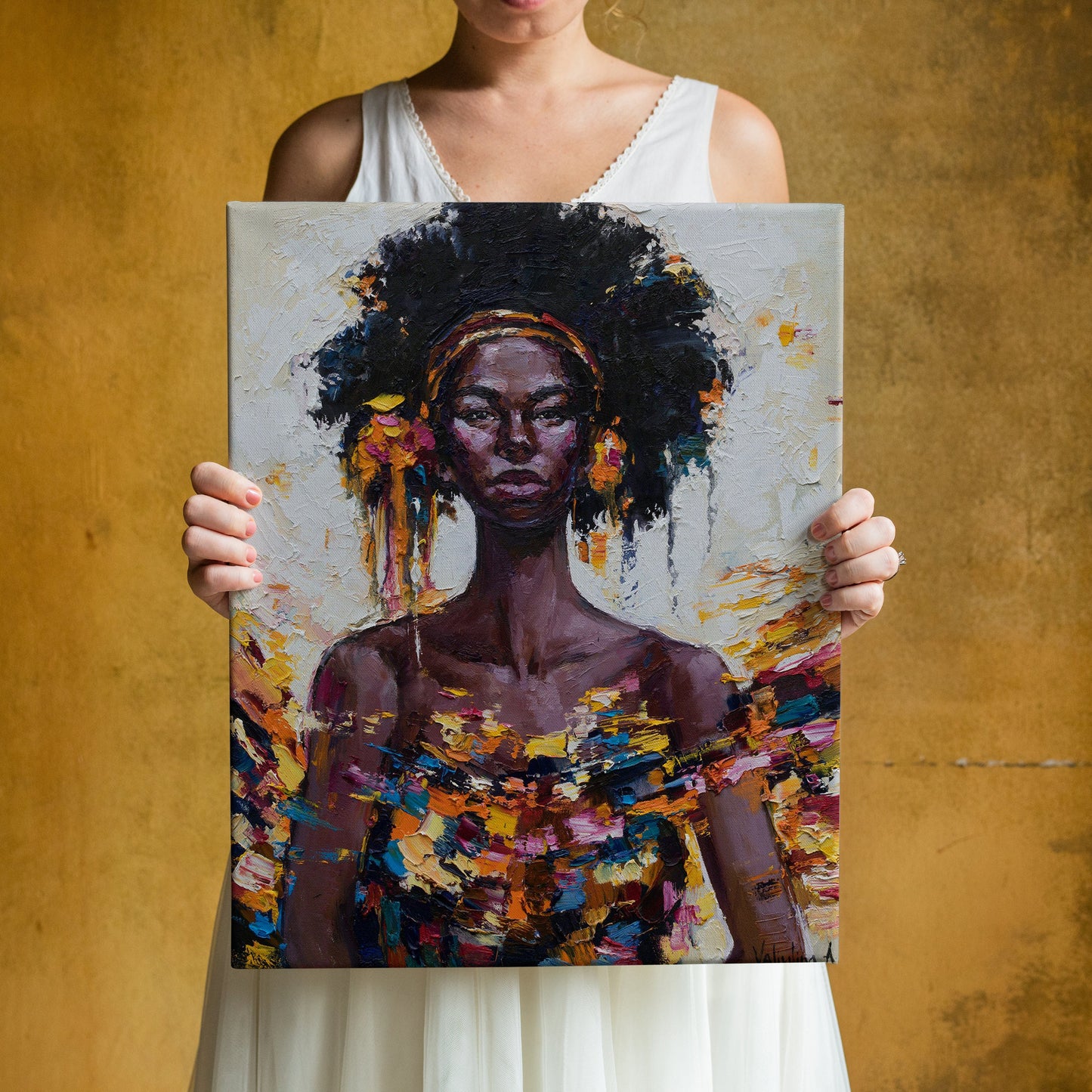 a woman holding up a painting of a woman