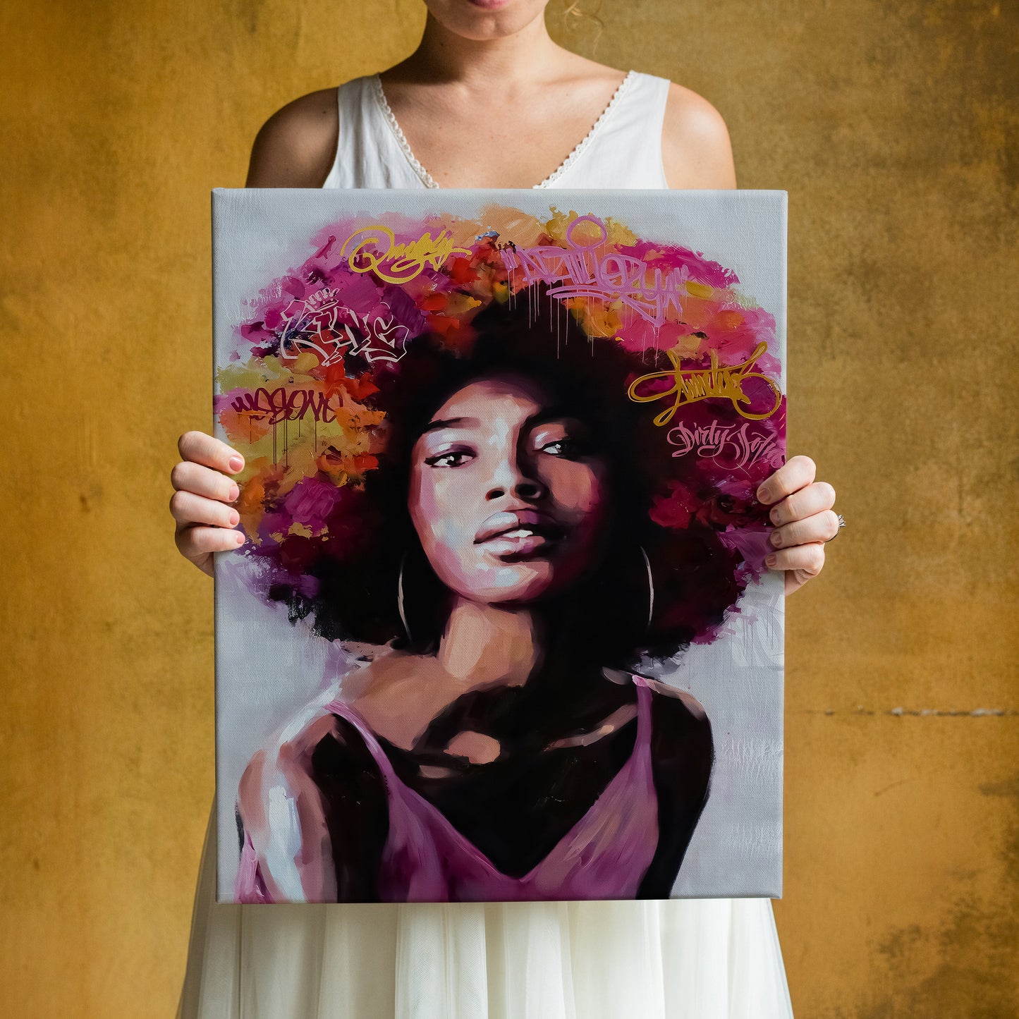 a woman holding a painting of a woman with afro hair