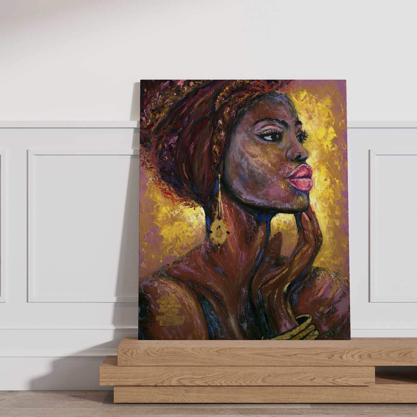 a painting of a woman's face on a wall