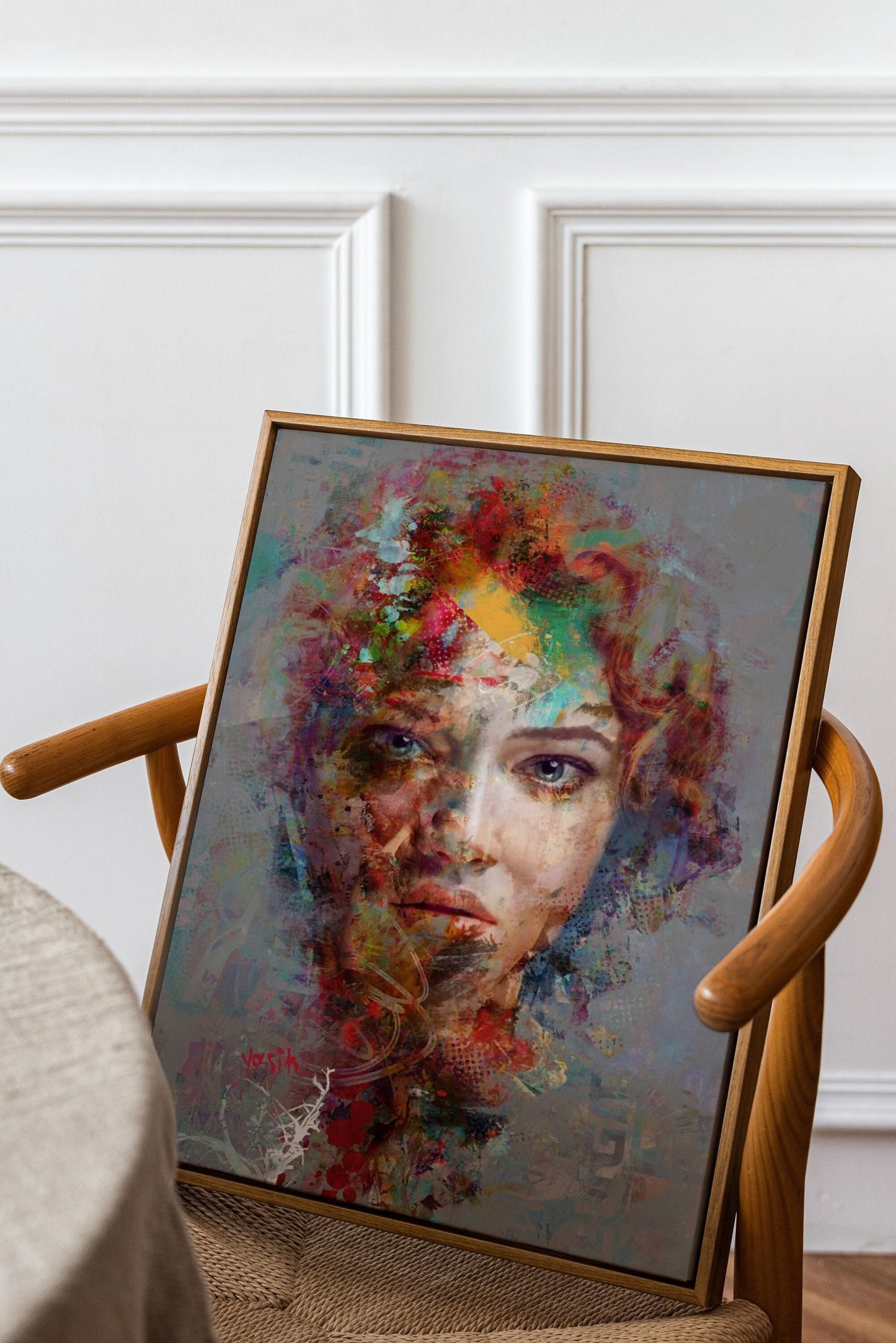 a painting of a woman's face on a chair
