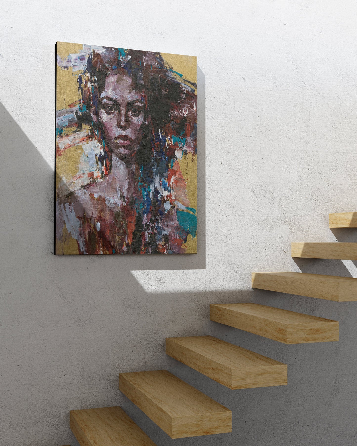 a painting hanging on a wall next to a stair case