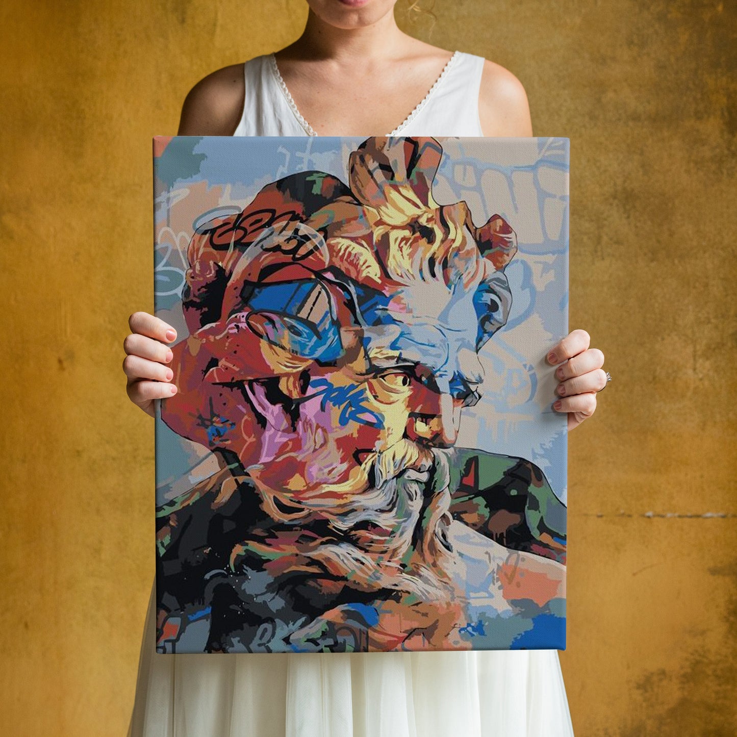 a woman holding up a painting of a man