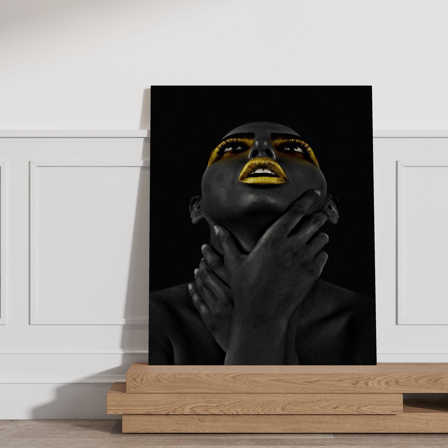 a black and white photo of a woman with her hands on her face