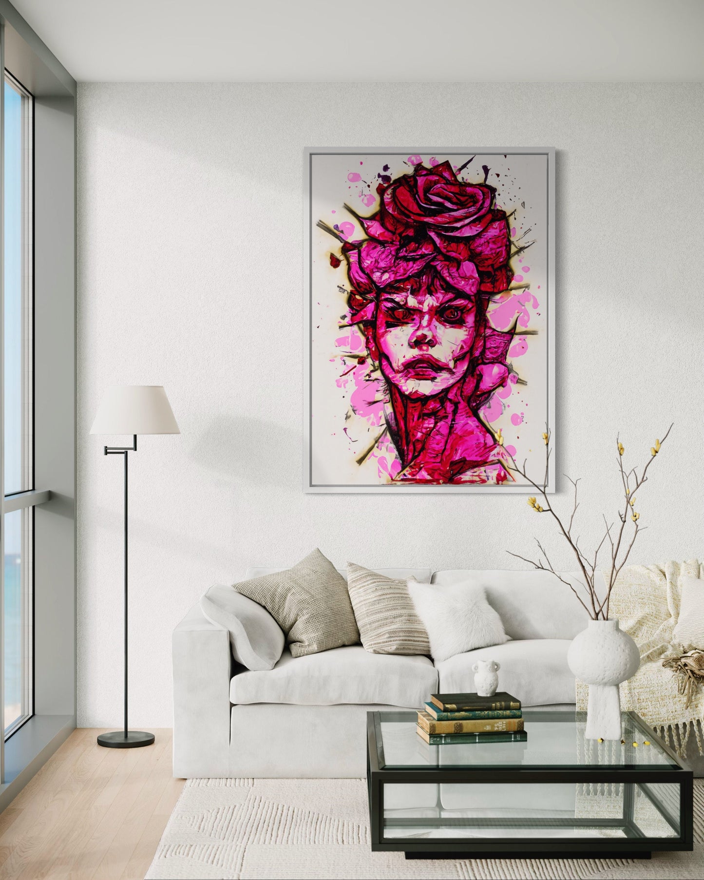 a living room with a white couch and a painting on the wall