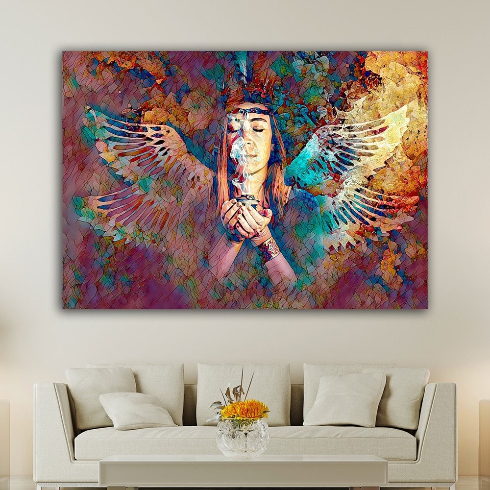 a living room with a couch and a painting on the wall