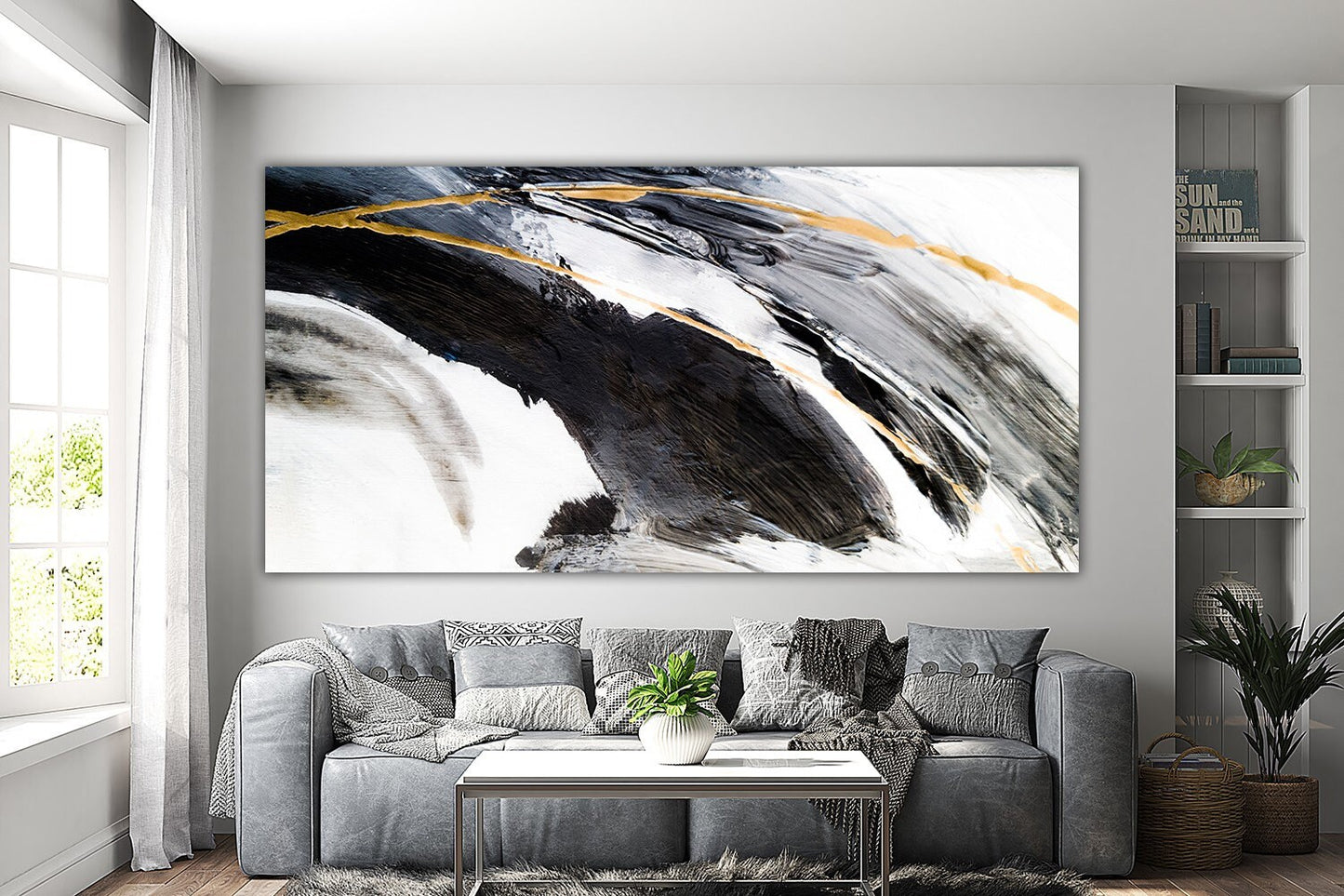 a living room with a couch and a painting on the wall