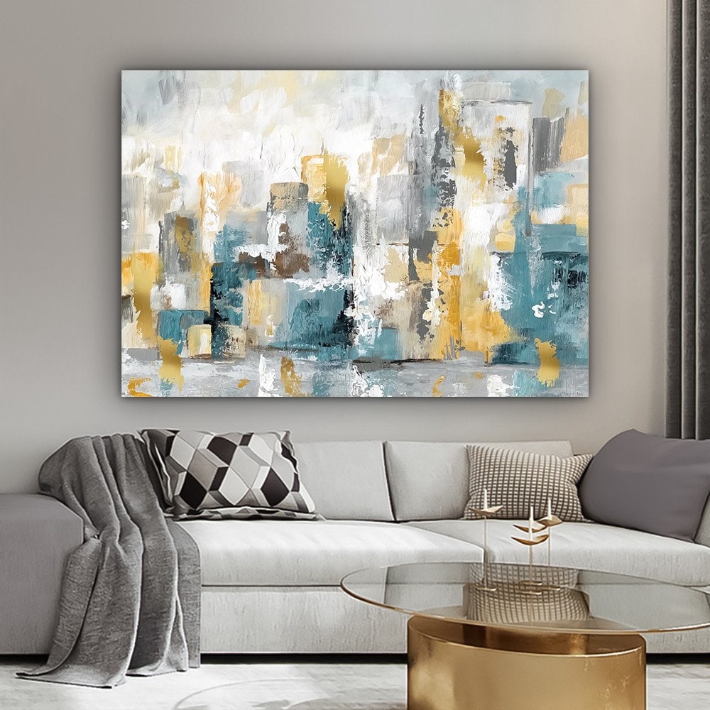 a living room with a large painting on the wall