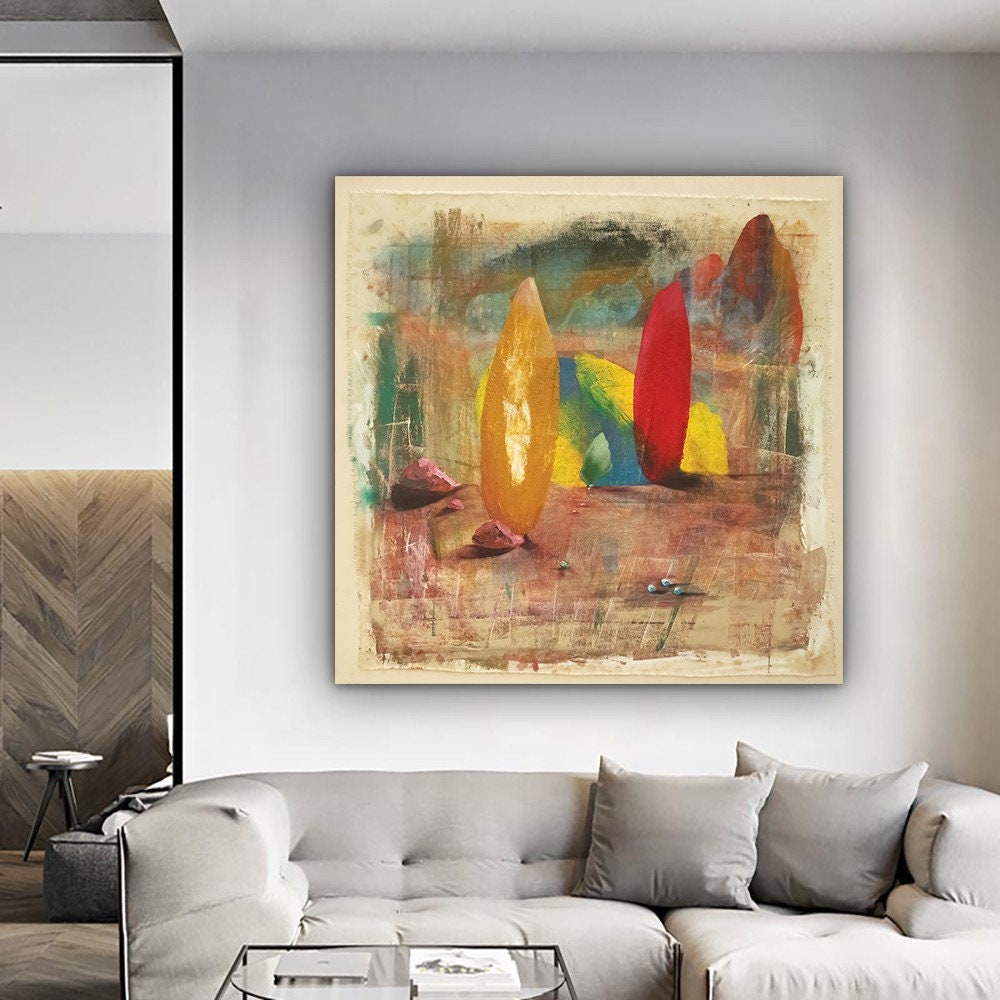 a living room with a couch and a painting on the wall