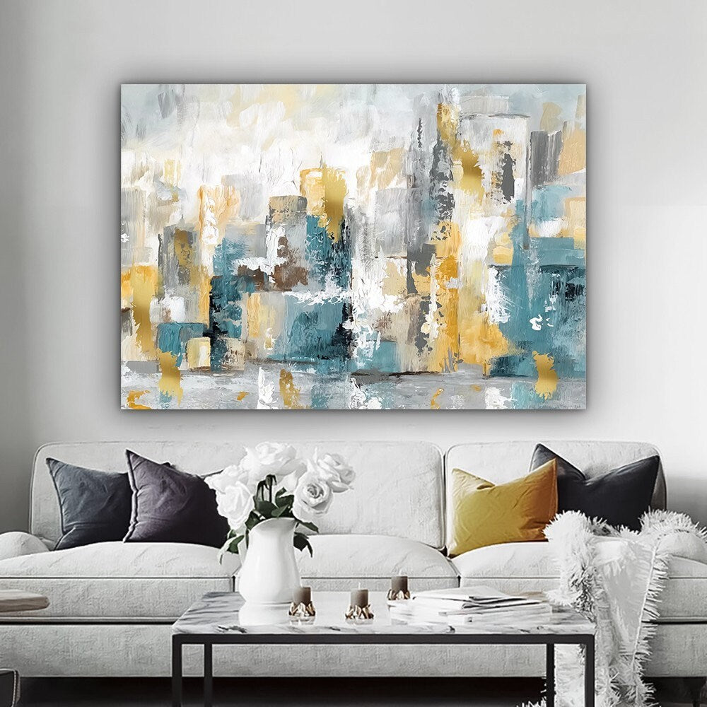 a living room with a couch and a painting on the wall