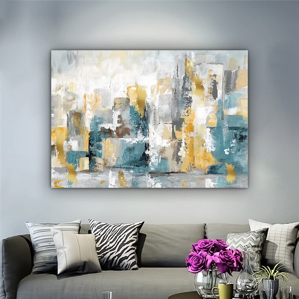 a living room filled with furniture and a painting on the wall