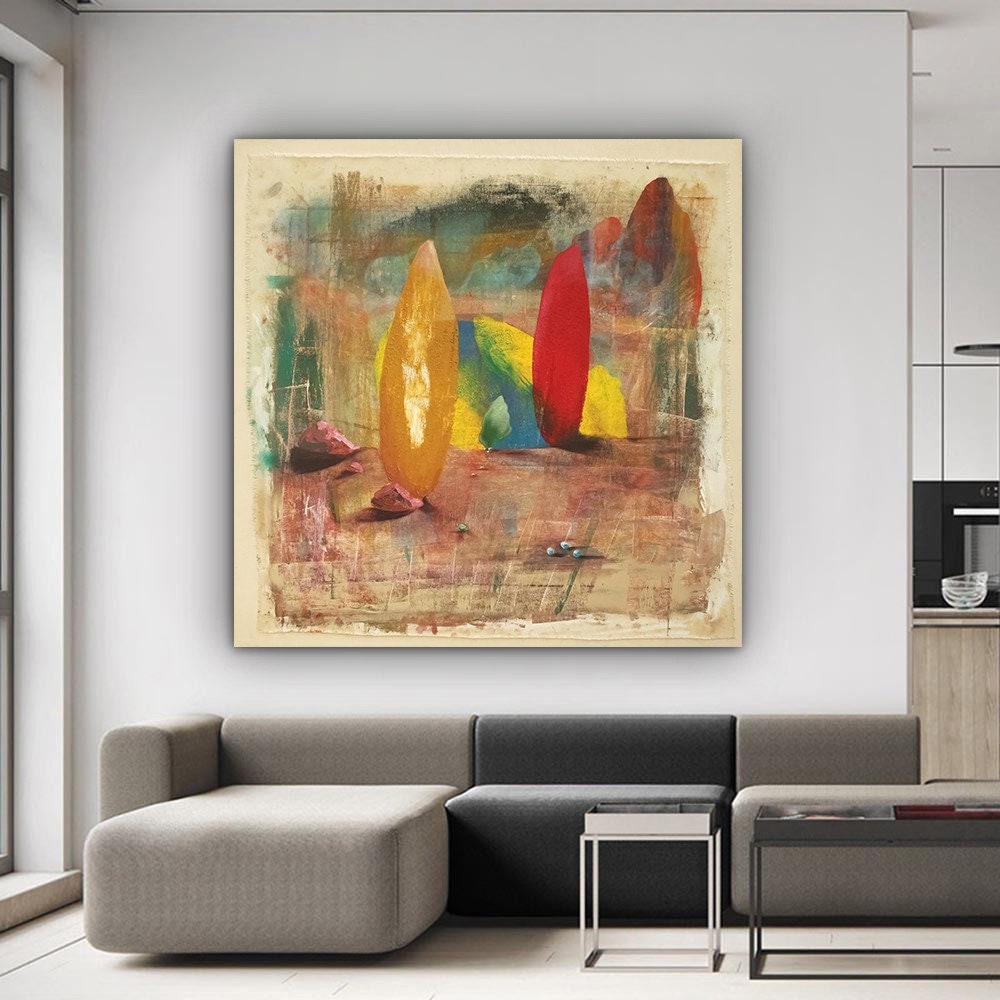 a living room with a couch and a painting on the wall