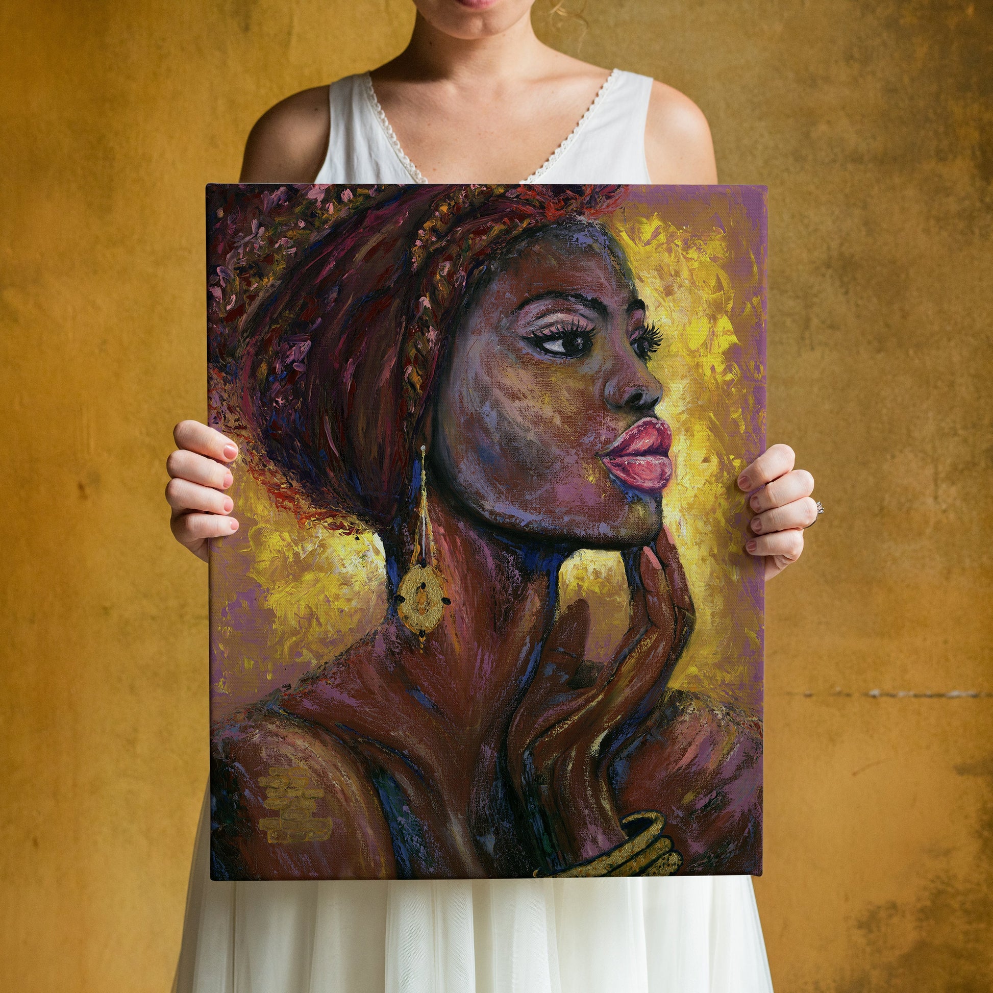 a woman holding a painting of a black woman