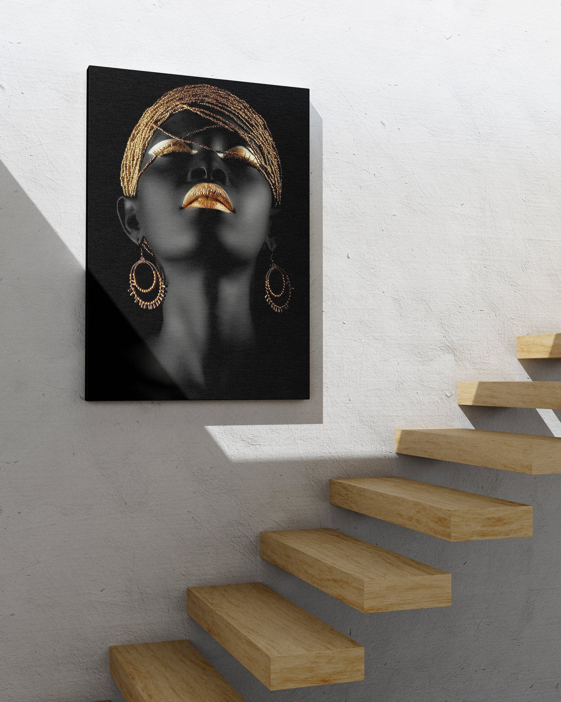 a painting of a woman&#39;s face on a white wall