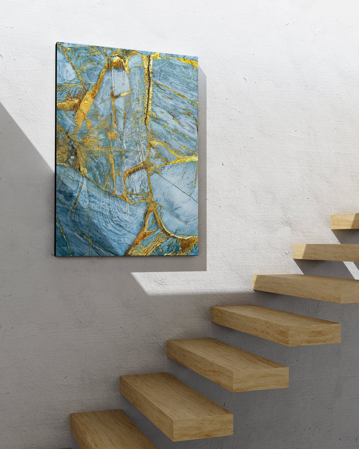 a painting hanging on a wall next to a stair case