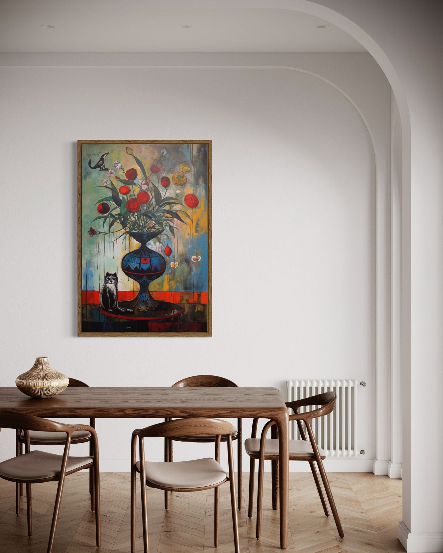 a painting hangs above a dining room table