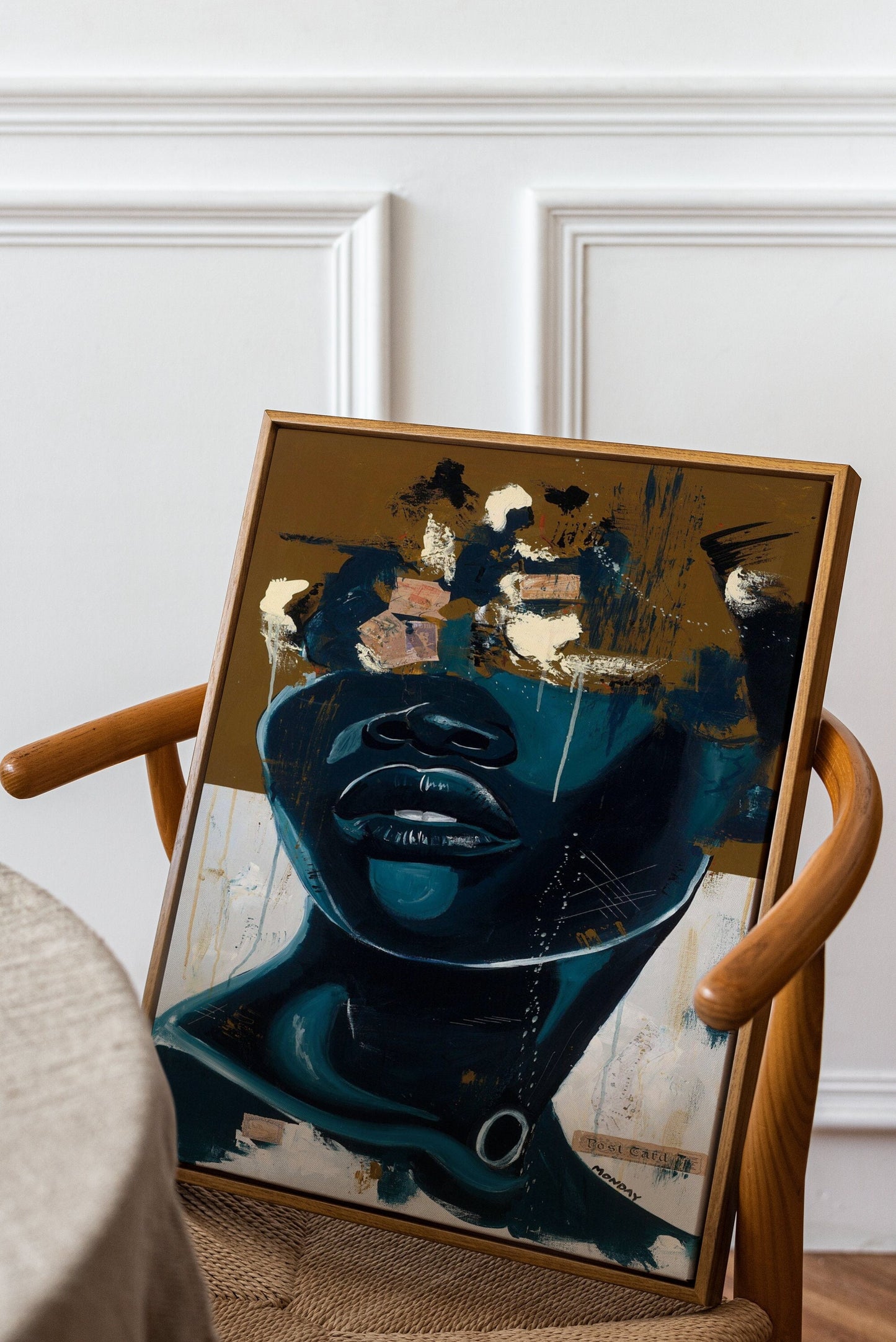 a chair with a painting on the back of it