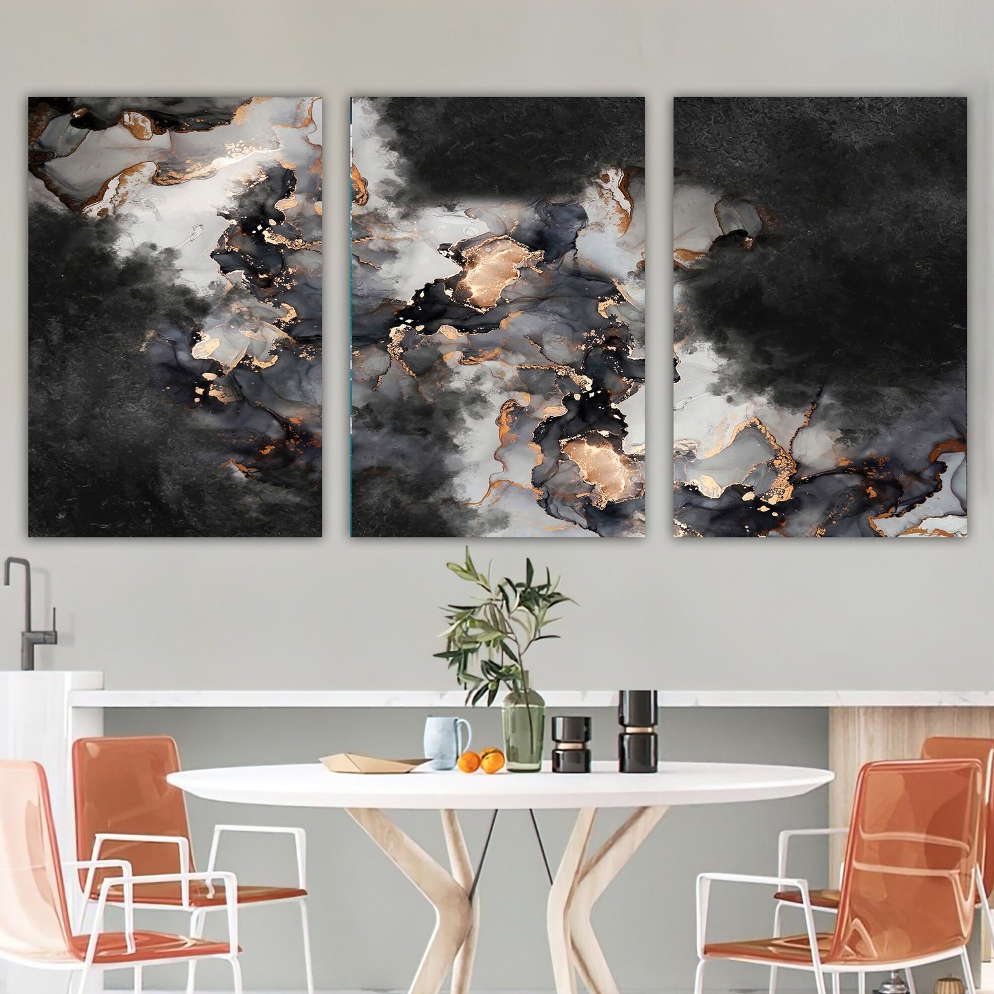 a dining room table with two paintings on the wall