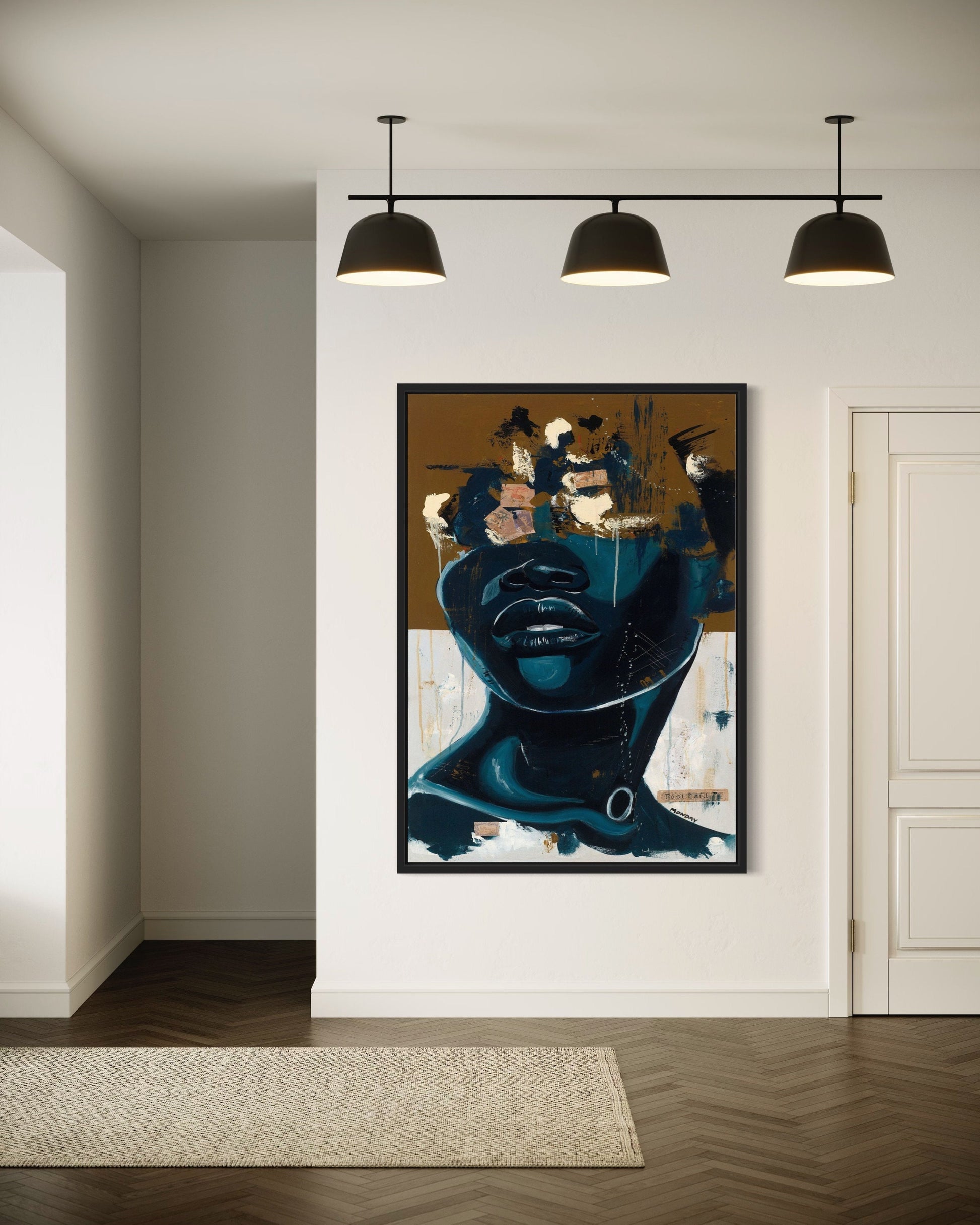 a painting hanging on a wall in a room