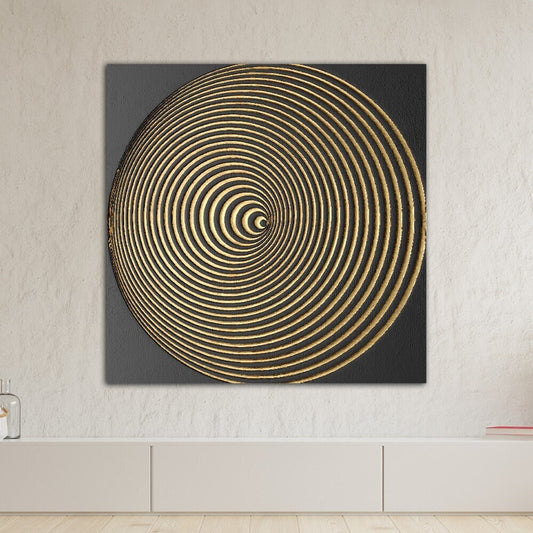 a black and gold painting on a white wall