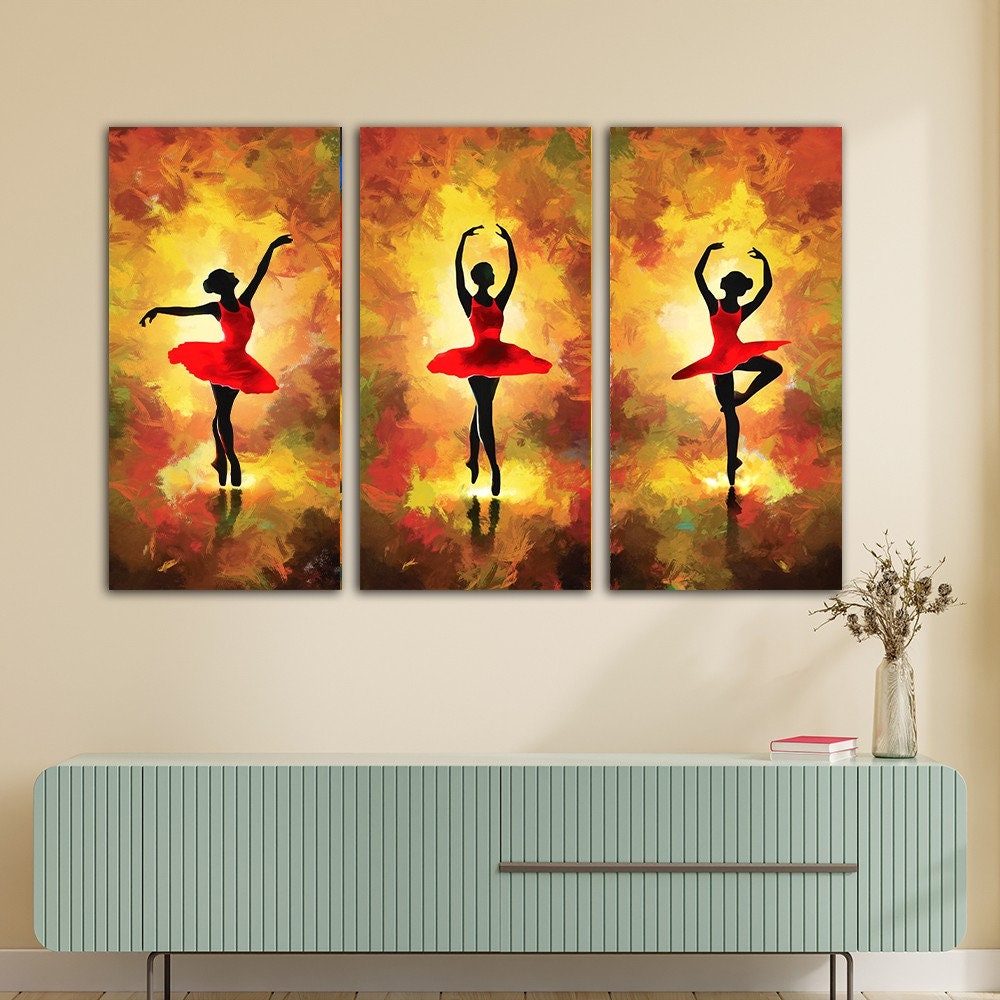 a painting of three ballerinas on a wall