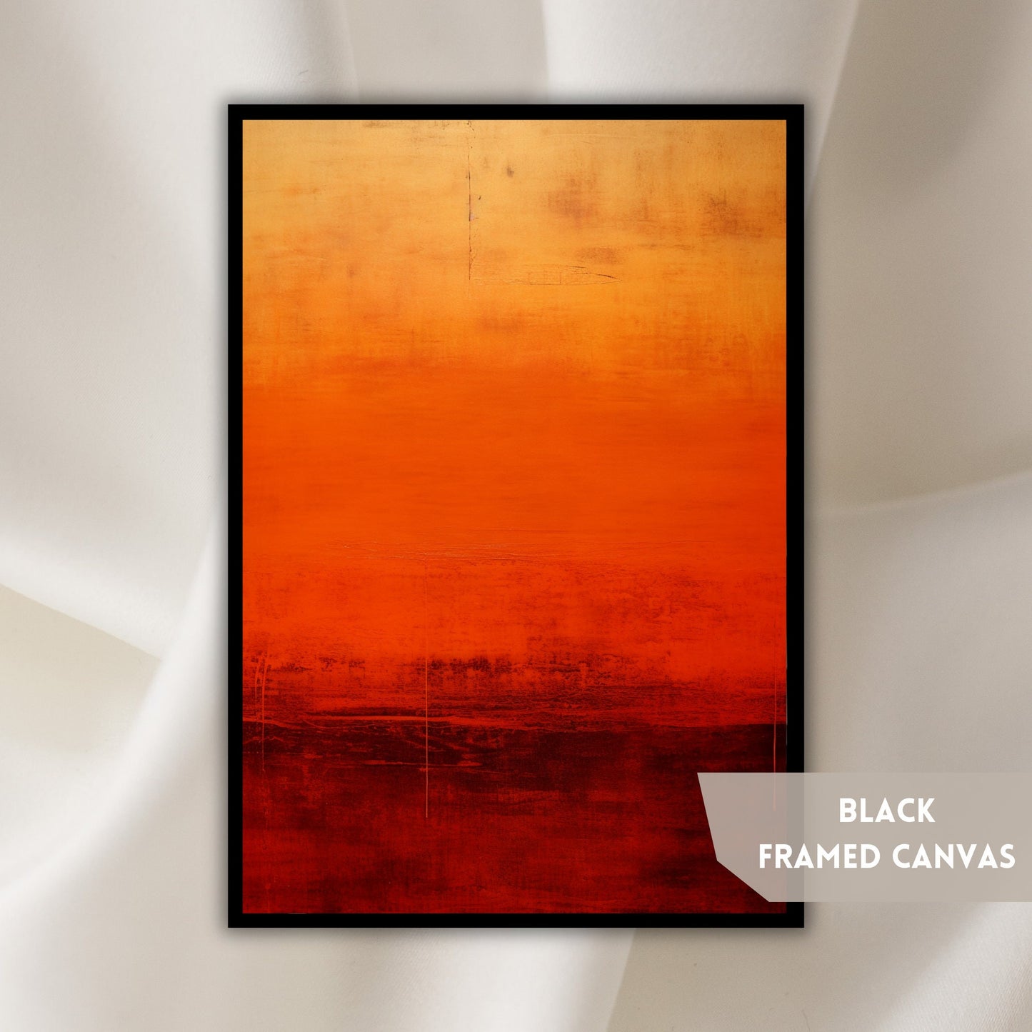 an orange and red painting hanging on a wall